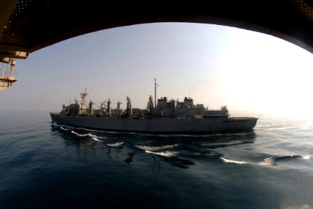 US Navy 070925-N-5928K-002 Nuclear-powered aircraft carrier USS Enterprise (CVN 65) transits alongside the Military Sealift Command fast combat support ship USNS Supply (T-AOE 6), prior to conducting a replenishment at sea