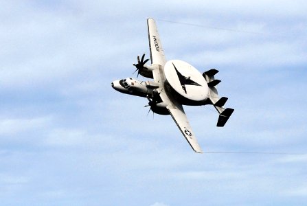 US Navy 070926-N-0890S-022 An E-2C Hawkeye, assigned to the Wallbangers of Carrier Airborne Early Warning Squadron (VAW) 117, flies over the flight deck during a Tiger Cruise air power demonstration