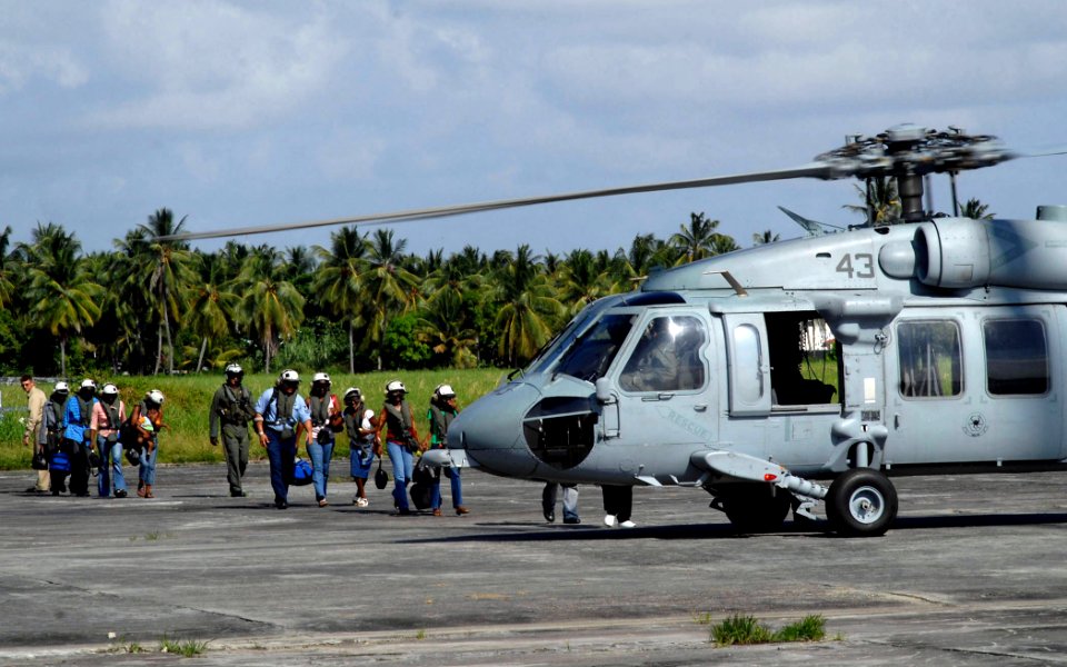 US Navy 070925-N-0194K-230 Patients transporting to Military Sealift Command hospital ship USNS Comfort (T-AH 20) board an MH-60S Seahawk, from Helicopter Sea Combat Squadron (HSC) 28, at the Ogle Airport
