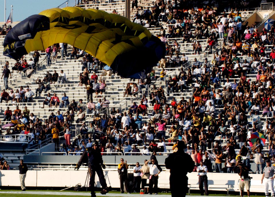 US Navy 070929-N-5208T-005 A member of the U.S. Navy Parachute Demonstration Team, the Leap Frogs, jumps into the Cotton Bowl as part of Dallas Navy Week