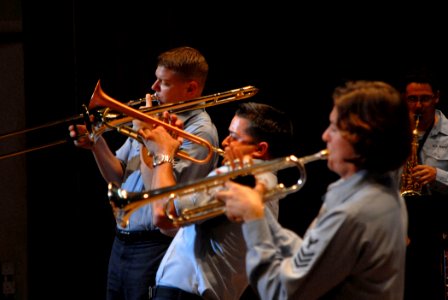 US Navy 070929-N-7092S-105 From left, U.S. Navy Showband members Musician 1st Class Joe Davidson, Musician 2nd Class Brandon Barbee and Musician 1st Class Amanda Marquis perform at the National Cultural Centre