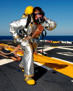 US Navy 070925-N-4856C-022 Aviation Boatswain's Mate (Handling) 2nd Class Eric L. Koster, from Pocahontas, Ark., participates in an aircraft fire drill on the flight deck of amphibious assault ship USS Iwo Jima (LHD 7)