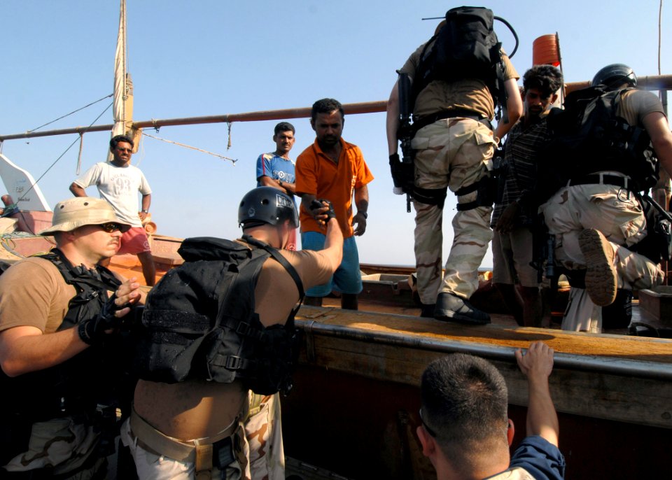 US Navy 070926-N-0841E-060 Boarding team members from the guided-missile frigate USS Carr (FFG 52) render assistance to a United Arab Emirates-flagged fishing dhow as part of an interaction patrol