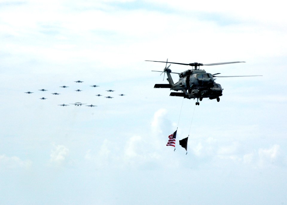 US Navy 070926-N-7128A-056 Two SH-60F Seahawks precede a formation of aircraft assigned to Carrier Air Wing (CVW) 11 during a Tiger Cruise air power demonstration aboard nuclear-powered aircraft carrier USS Nimitz (CVN 68)
