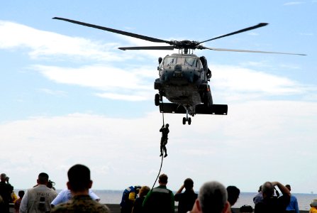 US Navy 070926-N-0890S-042 Sailors assigned to Explosive Ordnance Disposal Mobile Unit (EODMU) 11, Det. 3, fast-rope from an SH-60F Seahawk helicopter