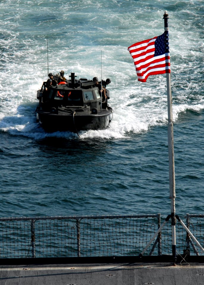 US Navy 071001-N-6710M-006 A light amphibious resupply cargo (LARC) prepares to enter the well deck of dock landing ship aboard USS Tortuga (LSD 46) while anchored off the coast of Japan