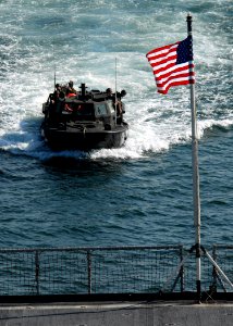 US Navy 071001-N-6710M-006 A light amphibious resupply cargo (LARC) prepares to enter the well deck of dock landing ship aboard USS Tortuga (LSD 46) while anchored off the coast of Japan