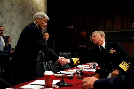 US Navy 070927-N-3642E-269 Adm. Gary Roughead, commander of U.S. Fleet Forces Command, shakes hands with Sen. John Warner, R-Va., following his testimony before the Committee on Armed Services during his confirmation hearing photo