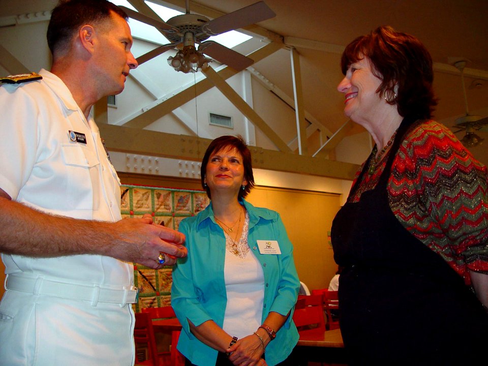 US Navy 071003-N-2888Q-003 Rear Adm. Jon W. Bayless Jr., commander of Navy Region Midwest, talks with Caroline Karp, volunteer coordinator, center, and Barbra McDermott, executive director of the Ronald McDonald House of Dallas