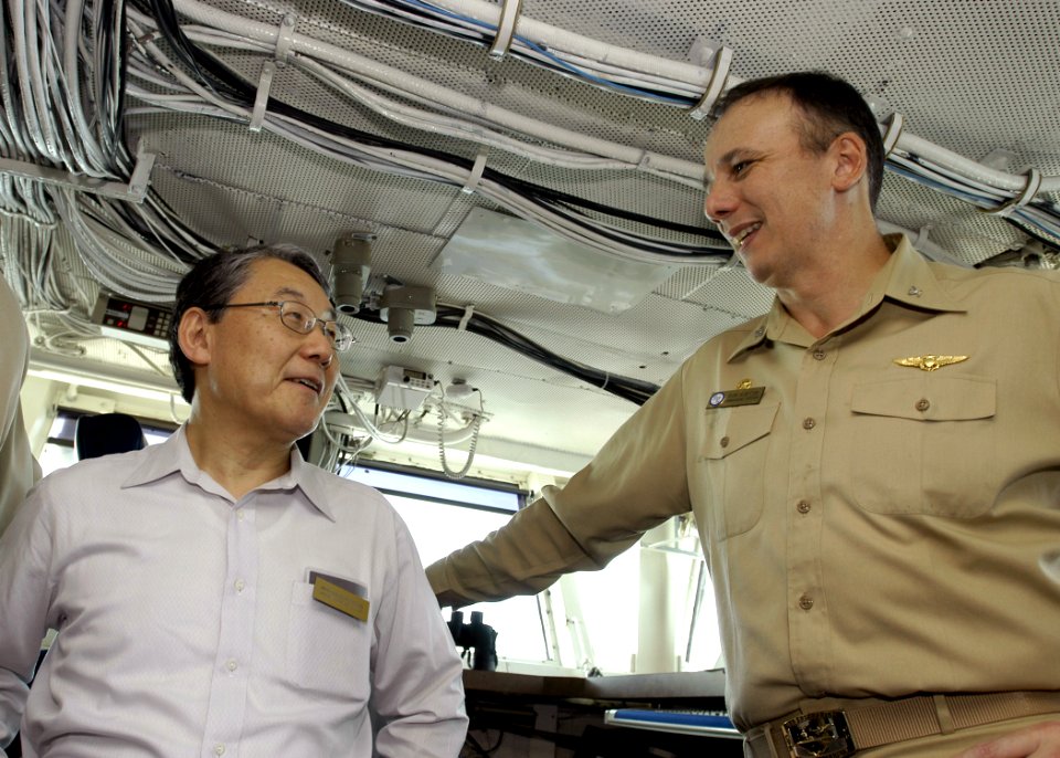 US Navy 071003-N-5681S-007 Takeshi Kondo, Japanese Ambassador to Bahrain, speaks with Capt. Ron Horton, commanding officer of USS Enterprise (CVN 65), during a recent visit to the nuclear-powered aircraft carrier