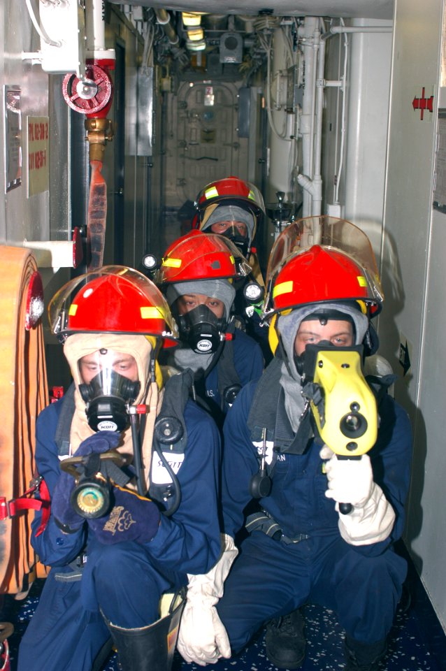 US Navy 070929-N-1831S-077 A fire team prepares to enter a space during a general quarters drill aboard amphibious assault ship USS Kearsarge (LHD 3)
