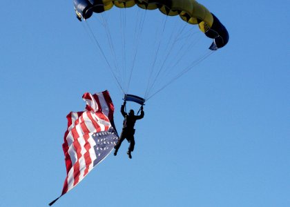 US Navy 070929-N-5208T-006 A member of the U.S. Navy Parachute Demonstration Team, the Leap Frogs, jumps into the Cotton Bowl as part of Dallas Navy Week photo