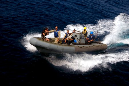 US Navy 070927-N-4014G-205 A rigid hull inflatable boat from guided-missile destroyer USS Porter (DDG 78) returns to the ship with personnel from guided-missile destroyer USS James E. Williams (DDG 95)