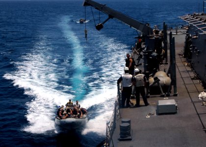 US Navy 070929-N-4014G-099 Members of the visit, board, search and seizure (VBSS) team assigned to guided-missile destroyer USS Porter (DDG 78) pull alongside the ship in a rigid hull inflatable boat for a training exercise