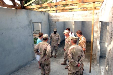 US Navy 070930-F-9074R-014 A group observes the work done by a U.S. Navy Mobile Construction Battalion during a tour of the Combined Joint Task Force-Horn of Africa project