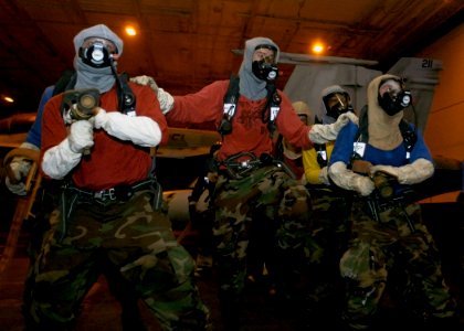 US Navy 070927-N-5681S-003 Sailors aboard nuclear-powered aircraft carrier USS Enterprise (CVN 65) simulate fighting a mock class alpha fire during a general quarters drill