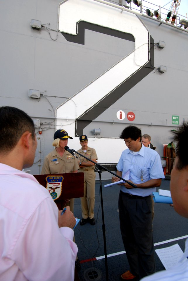 US Navy 070928-N-0237L-029 Commander, Expeditionary Strike Group 7-Task Force 76, Rear Adm. Carol M. Pottenger answers questions for local media during a media availability plan aboard the multipurpose amphibious assault ship U