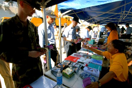 US Navy 070928-N-4399G-045 Sailors from amphibious command ship USS Blue Ridge (LCC 19) and the embarked 7th Fleet staff line up in front of health promotion fair booths