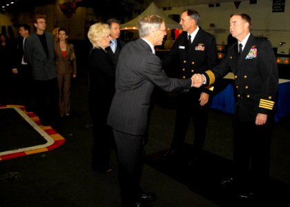 US Navy 071003-N-9898L-109 Rear Adm. Scott Van Buskirk, commander of Carrier Strike Group 9, and Capt. Patrick D. Hall, commanding officer of USS Abraham Lincoln (CVN 72), greet guests at a reception in Lincoln's hangar bay