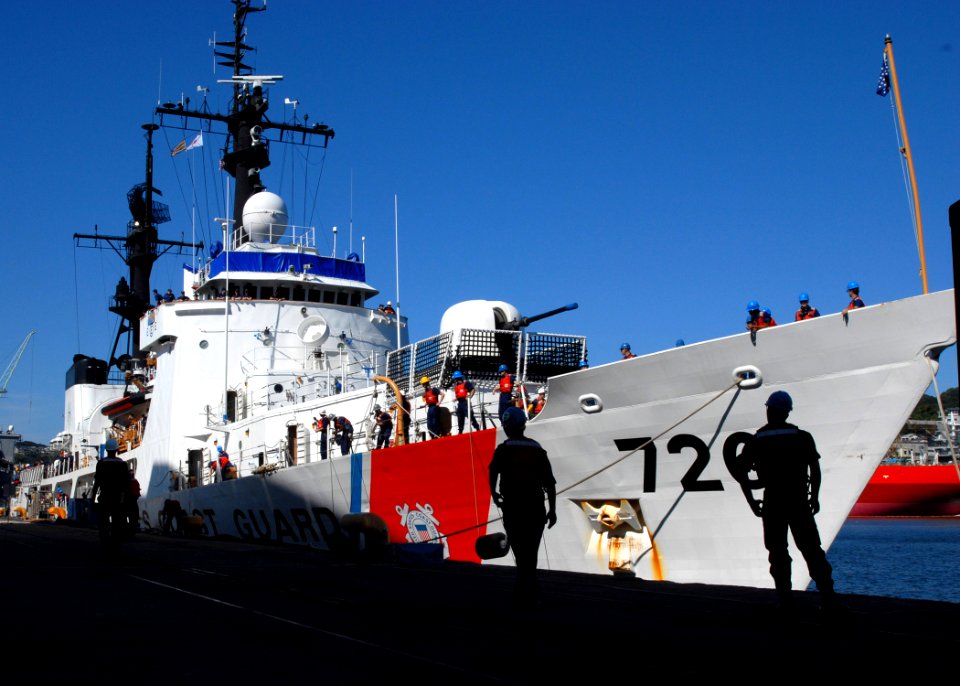 US Navy 071003-N-6936D-001 Line handlers from amphibious assault ship USS Essex (LHD 2) moor the U.S. Coast Guard high-endurance cutter USCGC Midgett (WHEC 726) at Fleet Activities Sasebo