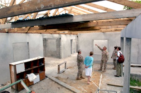 US Navy 070930-F-9074R-017 A group observes the work done by a U.S. Navy Mobile Construction Battalion during a tour of the Combined Joint Task Force-Horn of Africa project