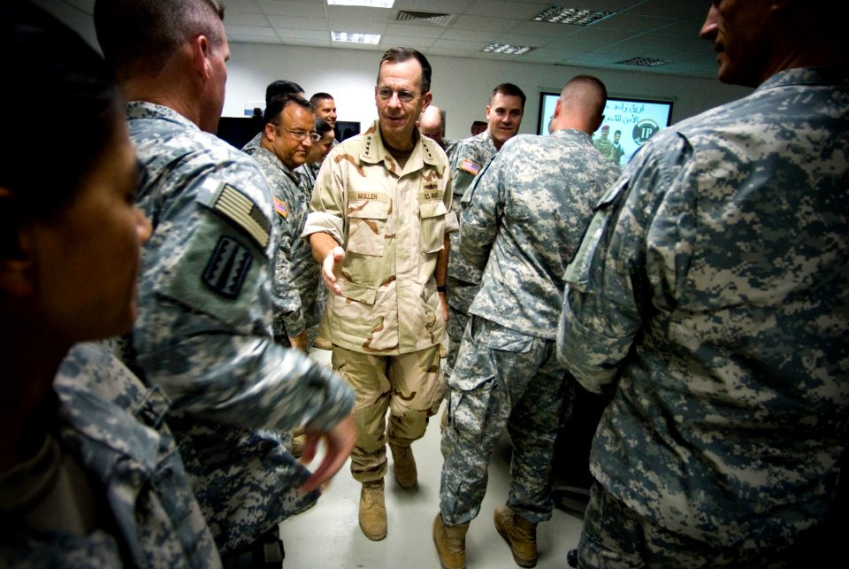 US Navy 071004-N-0696M-269 Adm. Mike Mullen, chairman of the Joint Chiefs of Staff, greets service members assigned to the 25th Infantry Division deployed to Forward Operating Base Marez