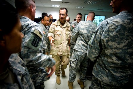 US Navy 071004-N-0696M-269 Adm. Mike Mullen, chairman of the Joint Chiefs of Staff, greets service members assigned to the 25th Infantry Division deployed to Forward Operating Base Marez