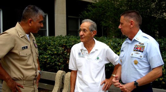 US Navy 071009-C-2529A-001 Master Chief Petty Officer of the Navy (MCPON) Joe R. Campa Jr. and Master Chief Petty Officer of the Coast Guard (MCPOCG) Charles Bowen talk with Ernest Sylvester, a Navy World War II veteran, during