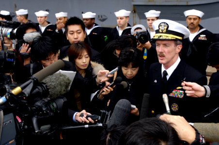 US Navy 071026-N-7883G-086 Rear Adm. Rick Wren, commander of Task Force 70, answers questions from the Japanese press after USS Kitty Hawk (CV 63) arrived in Muroran photo