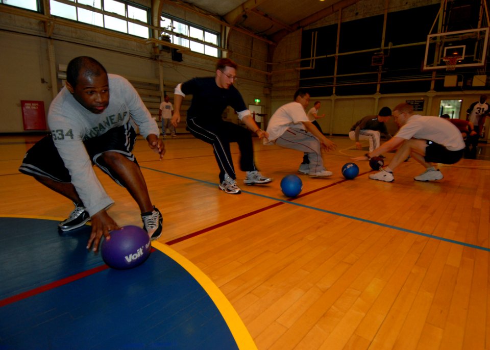 US Navy 071026-N-4399G-035 Sailors stationed aboard amphibious command ship USS Blue Ridge (LCC 19) run to the starting line at the start of a friendly game of dodge ball