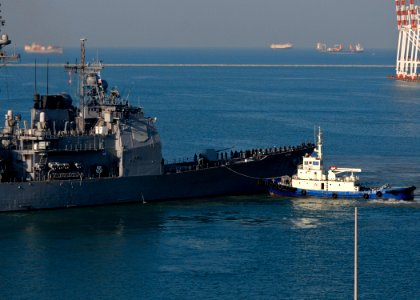 USS Cape St. George is led out of port. (6678793367)
