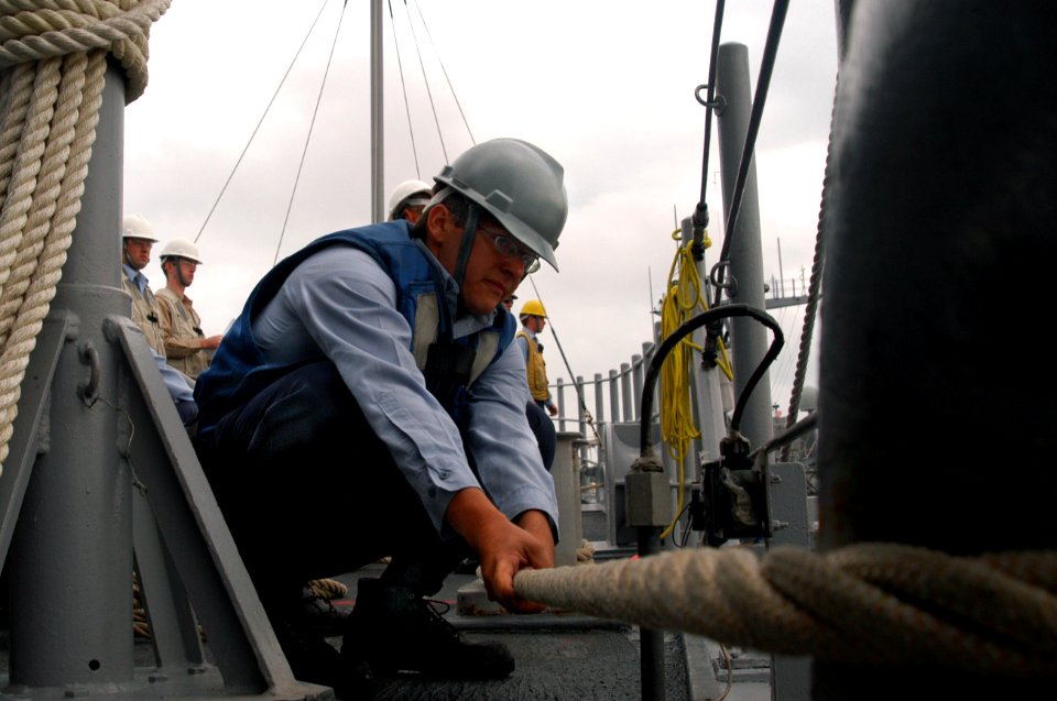 US Navy 071030-N-0807W-044 Mineman Seaman Kyle Rose, assigned to mine warfare ship USS Patriot (MCM 7), helps moor the ship at White Beach, Okinawa