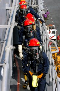 US Navy 071026-N-1831S-080 During a general quarters drill, the at-sea fire party prepares to enter the bridge of amphibious assault ship USS Kearsarge (LHD 3) after a mock missile attack