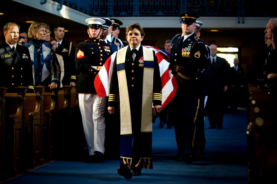 US Navy 071031-N-0696M-042 Capt. Margaret G. Kibben, U.S. Naval Academy chaplain, leads the ceremonial honor guard carrying the casket of Adm. William J. Crowe, 11th chairman of the Joint Chiefs of Staff