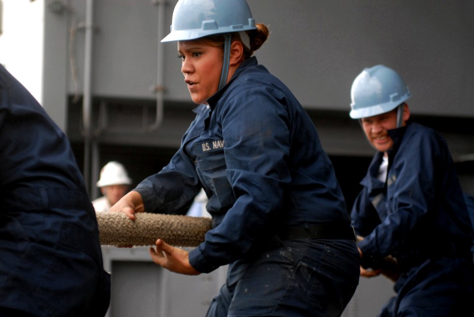 US Navy 071029-N-2959L-124 Seaman Vanessa Baker heaves a mooring line onto the fantail of Nimitz-class aircraft carrier USS Ronald Reagan during sea and anchor detail