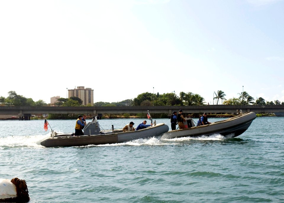 US Navy 071031-N-6674H-004 Two rigid hull inflatable boats (RHIB) race towards the finish line during the RHIB Race and Regatta held at Rainbow Bay Marina onboard Naval Station Pearl Harbor