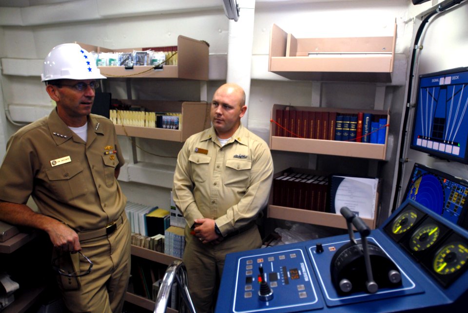 US Navy 071030-N-0486G-004 Adm. Jonathan W. Greenert, commander of U.S. Fleet Forces Command, talks with Chief Quartermaster Jasen Stevens about the ship's navigation, seamanship and ship handler training aboard guided-missile