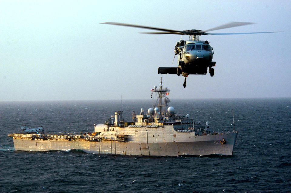 US Navy 071101-N-7955L-007 An MH-60S Seahawk, from Helicopter Combat Sea Squadron (HSC) 22, approaches the flight deck of amphibious assault ship USS Kearsarge (LHD 3) during a troop transport with amphibious transport dock USS