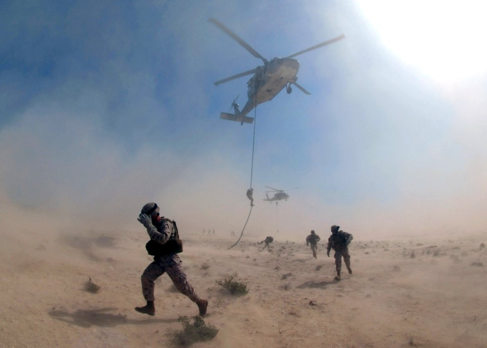 US Navy 071105-N-7027P-352 Marines attached to 4th Platoon, 2nd Fleet Anti-terrorism Security Team (FAST), practice fast roping out of a MH-60S Seahawk, assigned to Helicopter Sea Combat Squadron (HSC) 28, during a crisis respo