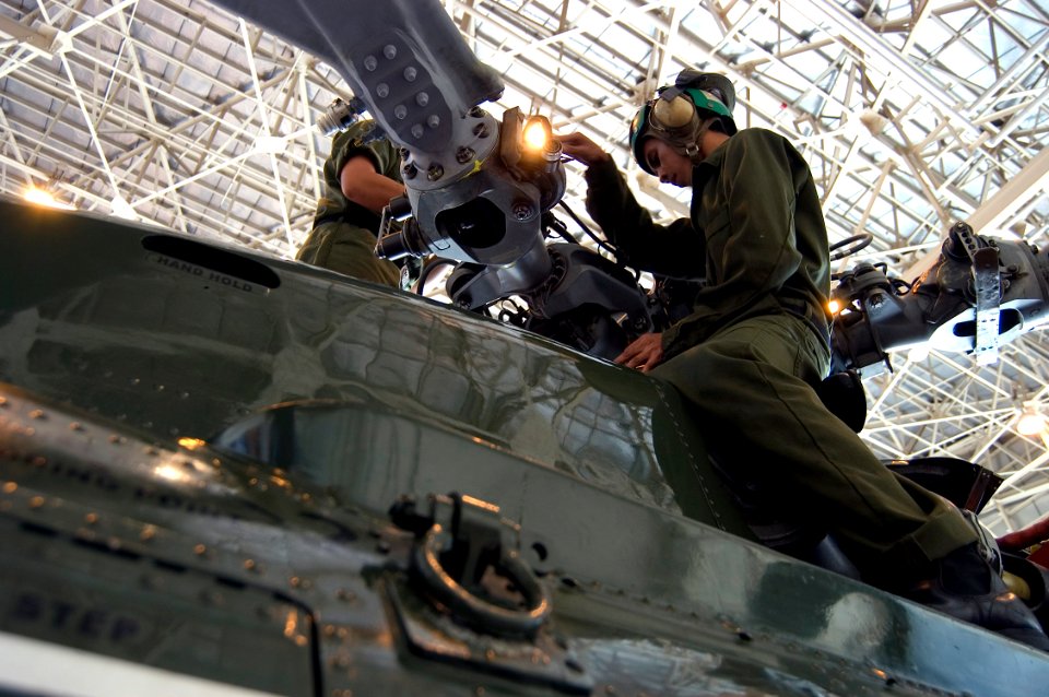 US Navy 071030-N-5253W-003 Sailors assigned to the Warlords of Helicopter Anti-Submarine Squadron Light (HSL) 51, perform routine maintenance on one of the squadron's SH-60F Seahawk helicopters on board Naval Air Facility Atsug