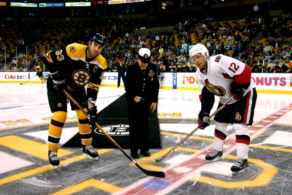 US Navy 071104-N-8110K-003 Command Master Chief Sandra Huffman, assigned to the guided-missile destroyer USS Sampson (DDG 102), drops the ceremonial first puck
