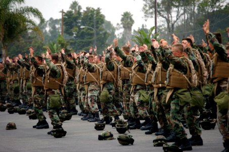 US Navy 071107-N-0775Y-002 Seabees assigned to Naval Mobile Construction Battalion (NMCB) 3 warm up with a set of jumping jacks before going on a two and a half mile march in full battle gear on board Port Hueneme photo