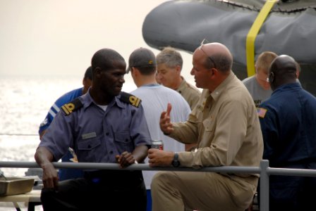 US Navy 071104-N-0193M-104 Lt. A.S. Omotosho, a Nigerian navy officer embarked with Africa Partnership Station (APS), talks with Cmdr. Martin Pompeo, commanding officer of USS Fort McHenry (LSD 43), during a steel beach picnic