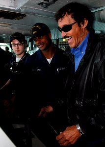 US Navy 071031-N-7981E-015 NASCAR racing legend Richard Petty takes a turn at the helm of Nimitz-class aircraft carrier USS Abraham Lincoln (CVN 72) under the instruction of the helmsman of the watch