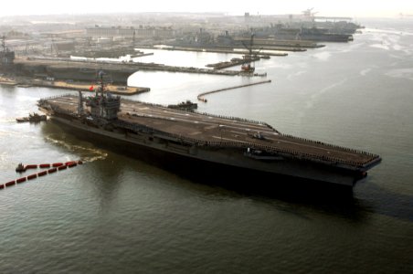 US Navy 071105-N-0535P-083 Sailors aboard Nimitz-class aircraft carrier USS Harry S. Truman (CVN 75) man the rails as the ship pulls out of Naval Station Norfolk