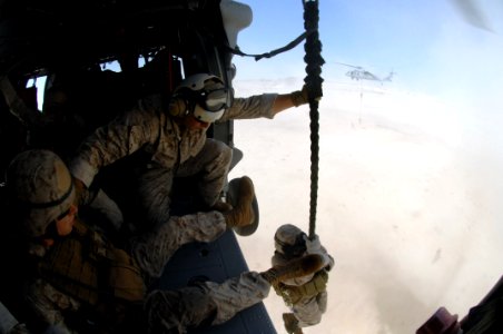 US Navy 071105-N-7027P-667 Marines attached to 4th Platoon, 2nd Fleet Anti-terrorism Security Team (FAST), practice fast roping out of a MH-60S Seahawk, assigned to Helicopter Sea Combat Squadron (HSC) 28, during a crisis respo