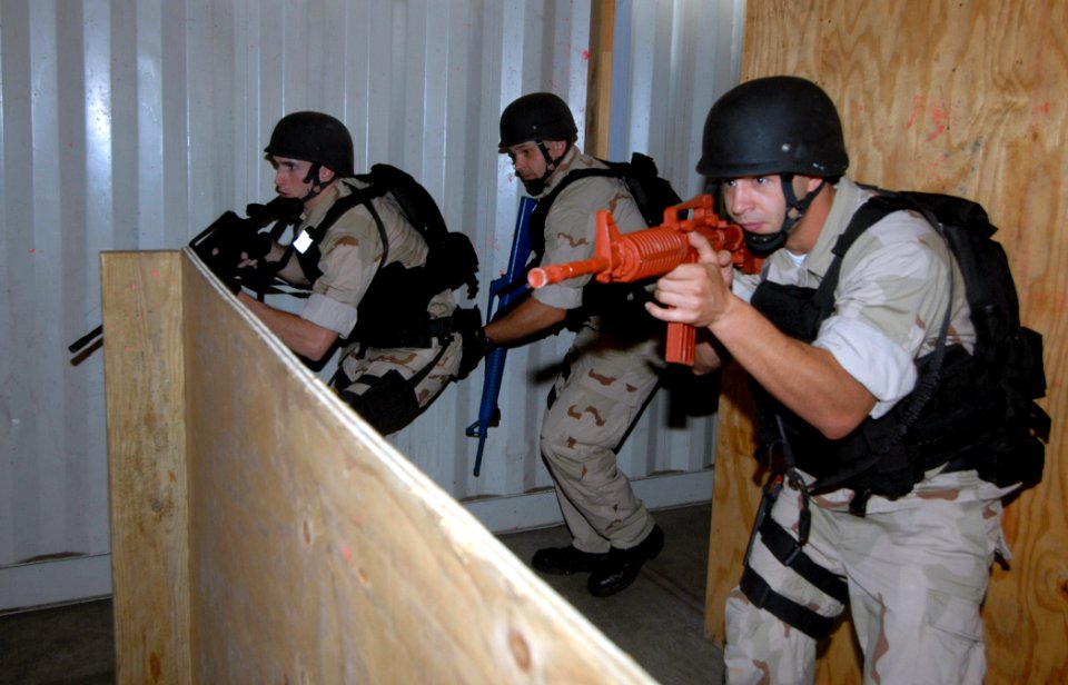 US Navy 071101-N-9758L-017 Sailors assigned to the guided missile cruiser USS Lake Erie (CG 70), tactically maneuvers through a passageway during a Non-Compliant Visit, Board, Search and Seizure drill