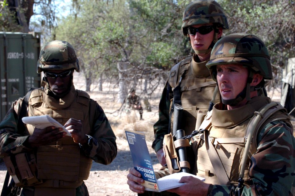 US Navy 071106-N-0775Y-044 Lt. j.g. Marc Nelson, briefs, his squad before going on convoy during an officer's field training exercise on board Fort Hunter Liggett