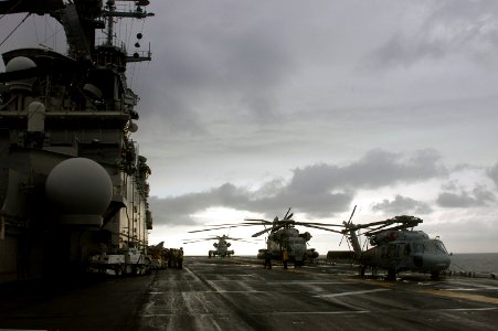 US Navy 071103-N-1831S-027 Amphibious assault ship USS Kearsarge (LHD 3) prepares to launch a UH-1N Huey and two CH-53E Sea Stallion helicopters assigned to Marine Medium Helicopter Squadron (HMM) 261 photo