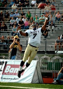 US Navy 071110-N-8053S-106 Navy Midshipmen running back, Reggie Campbell, reaches for a pass during the during the Navy vs. University of North Texas (UNT) football game